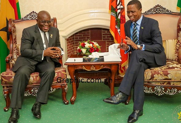 President Akufo-Addo in a discussion with  his host, President Lungu of Zambia, during one of the Ghaianan leader’s engagements